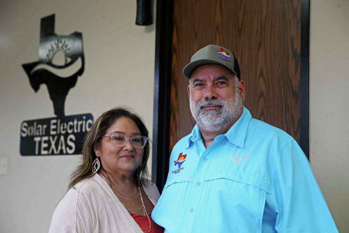 Melissa and Chuck Gonzales talk about their company, Solar Electric Texas, during an interview, Tuesday, Nov. 24, 2020.
