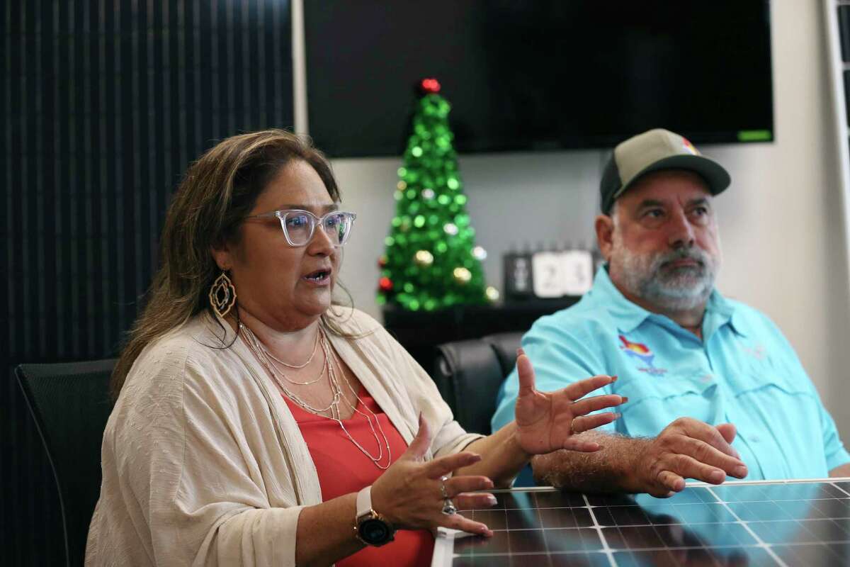 Melissa Gonzales, 53, and her husband, Chuck Gonzales, 63, talk about their company, Solar Electric Texas, during an interview, Tuesday, Nov. 24, 2020.