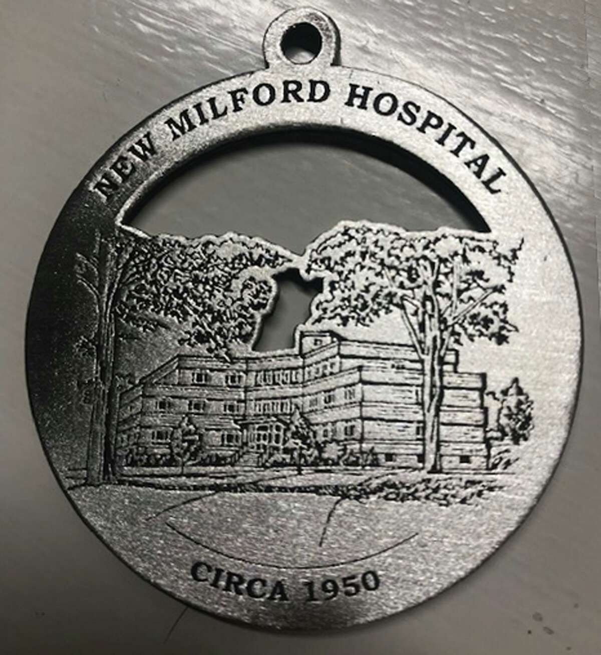 The New Milford Historical Society & Museum is offering its 2020 commemorative medallion for holiday purchase. This year's medallion features images of New Milford Hospital both as it appeared in mid-20th century from Elm Street and its contemporary look.