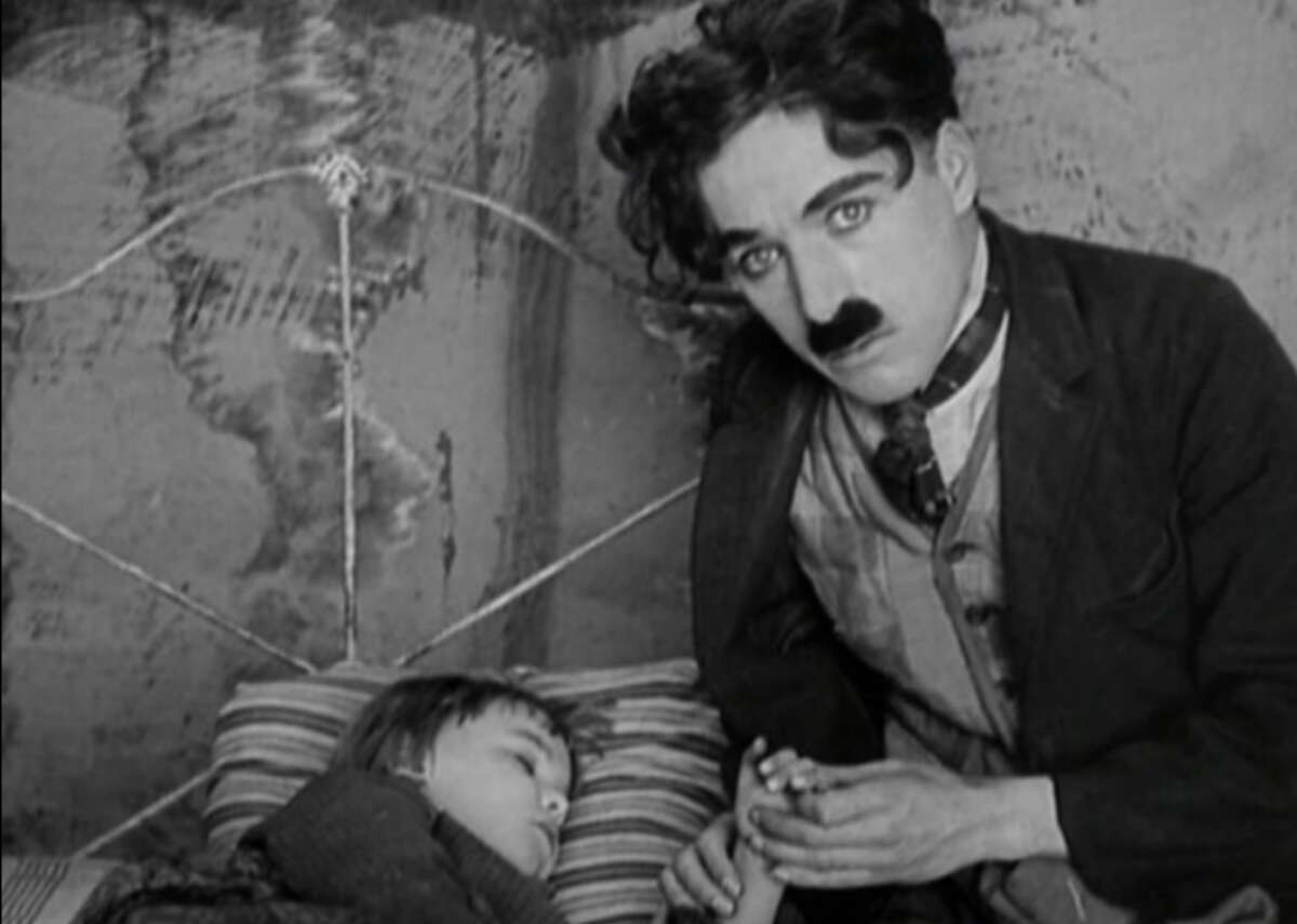 1921: The kid behind the camera Charlie Chaplin directed his first full-length film, “The Kid.” Chaplin also starred in the film, raising an orphan played by Jackie Coogan.