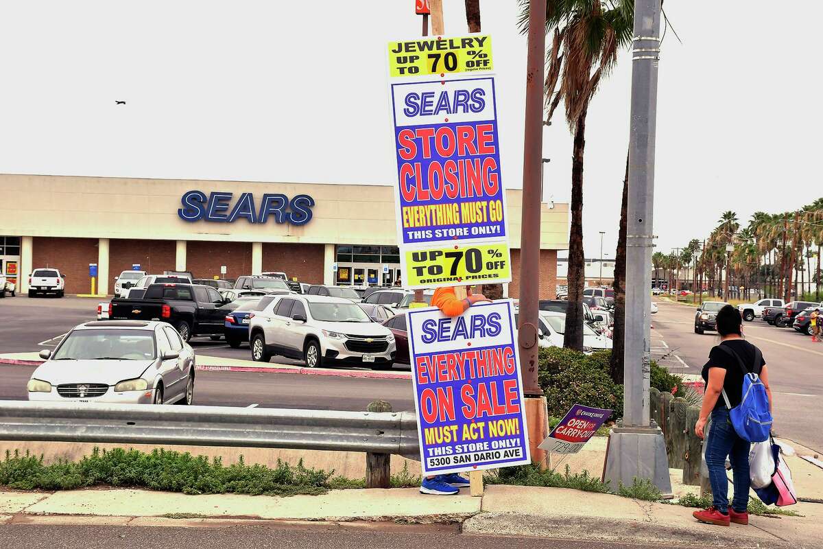 A man carries a sign advertising the closing of Sears at Mall del Norte on May 29. A spokesperson for Mall del Norte refuted a rumor spread on social media and confirmed to Laredo Morning Times that the mall is not closing.