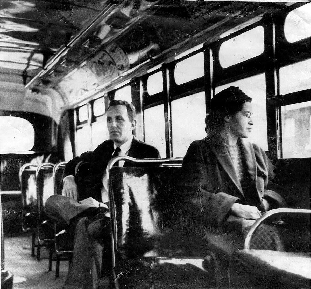 This undated file photo shows Rosa Parks riding on the Montgomery Area Transit System bus. Parks’ refusal to give up her bus seat to a white man sparked the modern civil rights movement. VIA Metropolitan Transit will offer free rides all day Friday in her honor.