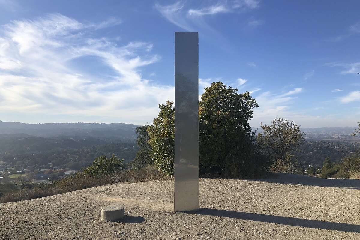 A monolith stands on a Stadium Park hillside in Atascadero, Calif., Tuesday, Dec. 2, 2020. Days after the discovery and swift disappearance of two shining metal monoliths half a world apart, another towering structure has popped up, this time at the pinnacle of a trail