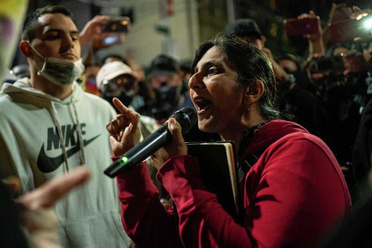 Seattle City Council member Kshama Sawant, a critic of Mayor Jenny Durkan and the Seattle Police Department, speaks as demonstrators hold a rally outside of the Seattle Police Departments East Precinct, which has been boarded up and protected by fencing, on June 8, 2020 in Seattle, Washington.