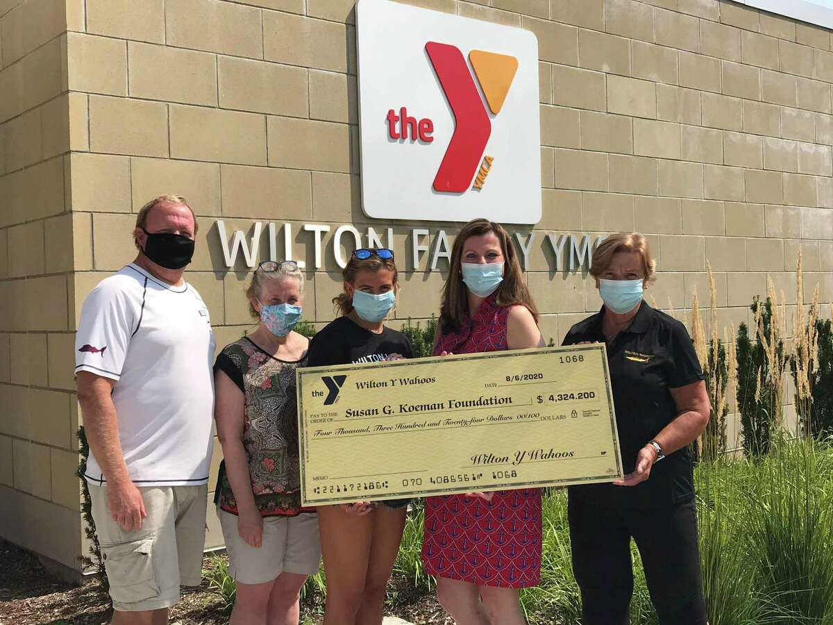 Representatives of the Wilton Y Wahoos met with Meg Staubley, Susan G. Komen Development Manager for Connecticut, to present a check for $4,324. From left are Wahoos Coach Todd Stevens, team captain Lori Ende-Skidell, Wahoos swimmer Olivia Crisafulli, Staubley, and Joann McCaffrey, Wilton Wahoos finance and office manager.
