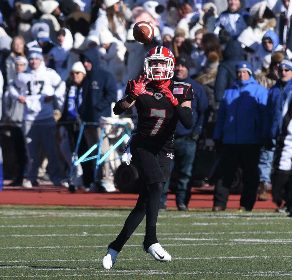 New Canaan's Zach LaPolice (7) makes a reception against Darien during the Turkey Bowl football game at Stamford's Boyle Stadium on Thanksgiving, Nov. 22, 2018.