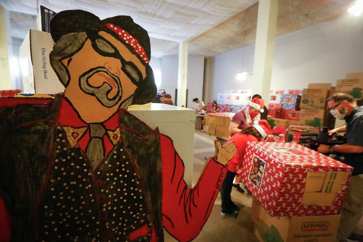 A large cutout of Pancho Claus greeted volunteers that came to the aid of Richard Reyes, who for the first time is asking for help to continue the holiday tradition of spreading joy to underprivileged children Saturday, Nov. 14, 2020, in Houston.