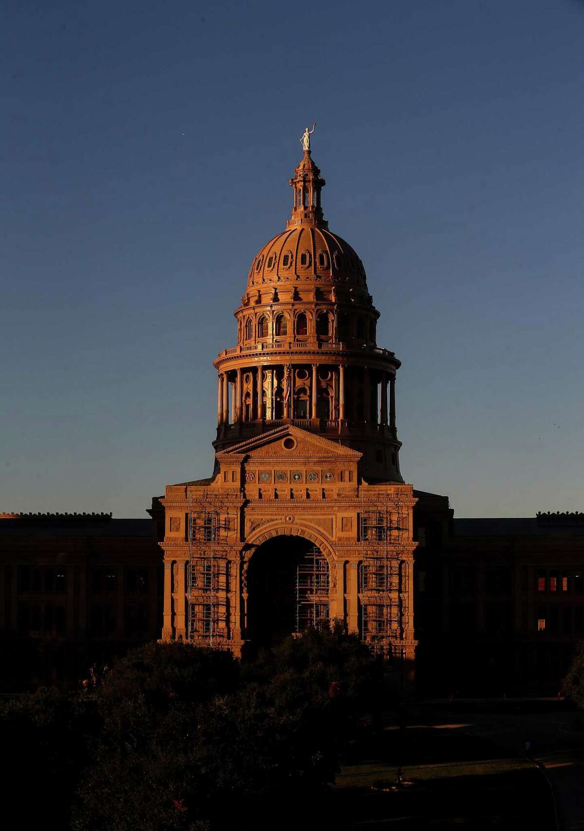 The sun sets over the Texas Capitol on Friday, Oct. 21, 2016, in Austin.