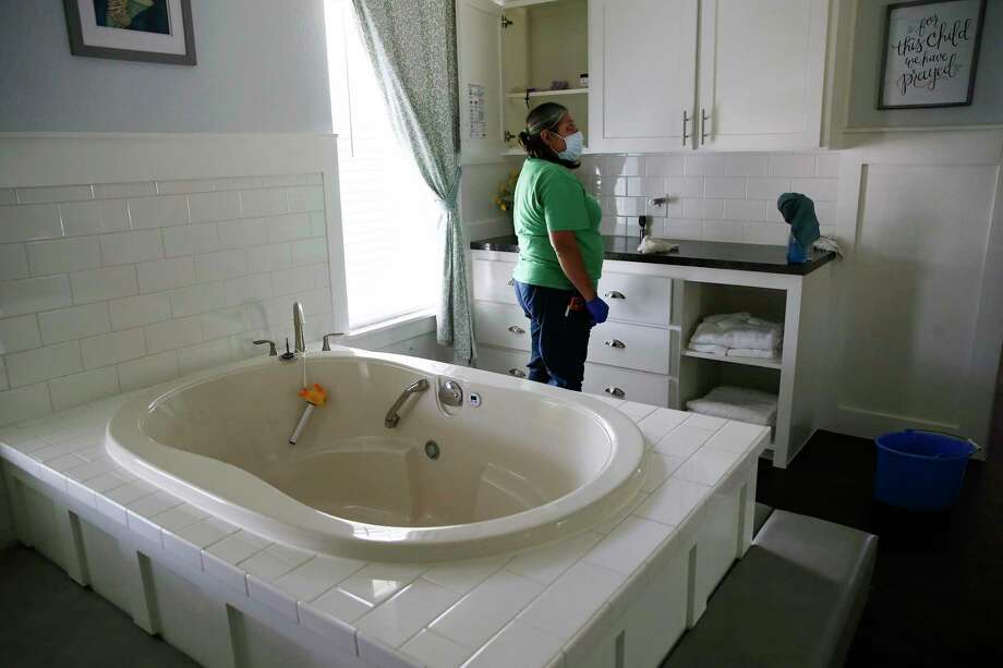 Maria Peña cleans one of three birth houses at the Holy Family Birth Center. It’s one of the only free-standing birth centers in Texas that operates as a nonprofit to serve mothers and babies who might otherwise face barriers to health care. Photo: Jerry Lara /Staff Photographer / **MANDATORY CREDIT FOR PHOTOG AND SAN ANTONIO EXPRESS-NEWS/NO SALES/MAGS OUT/TV   © 2019 San Antonio Express-News