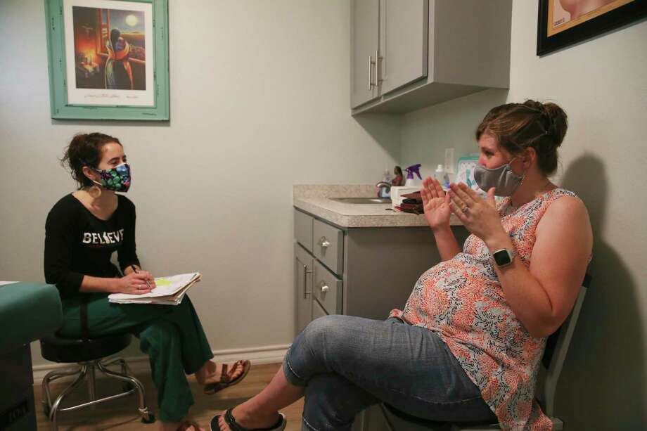 Certified nurse midwife Annie Leone talks with her patient, Melissa Woodfin. Prenatal care visits with the midwives at Holy Family can last up to 45 minutes — much longer than a typical doctor’s appointment. Photo: Jerry Lara /Staff Photographer / **MANDATORY CREDIT FOR PHOTOG AND SAN ANTONIO EXPRESS-NEWS/NO SALES/MAGS OUT/TV   © 2019 San Antonio Express-News