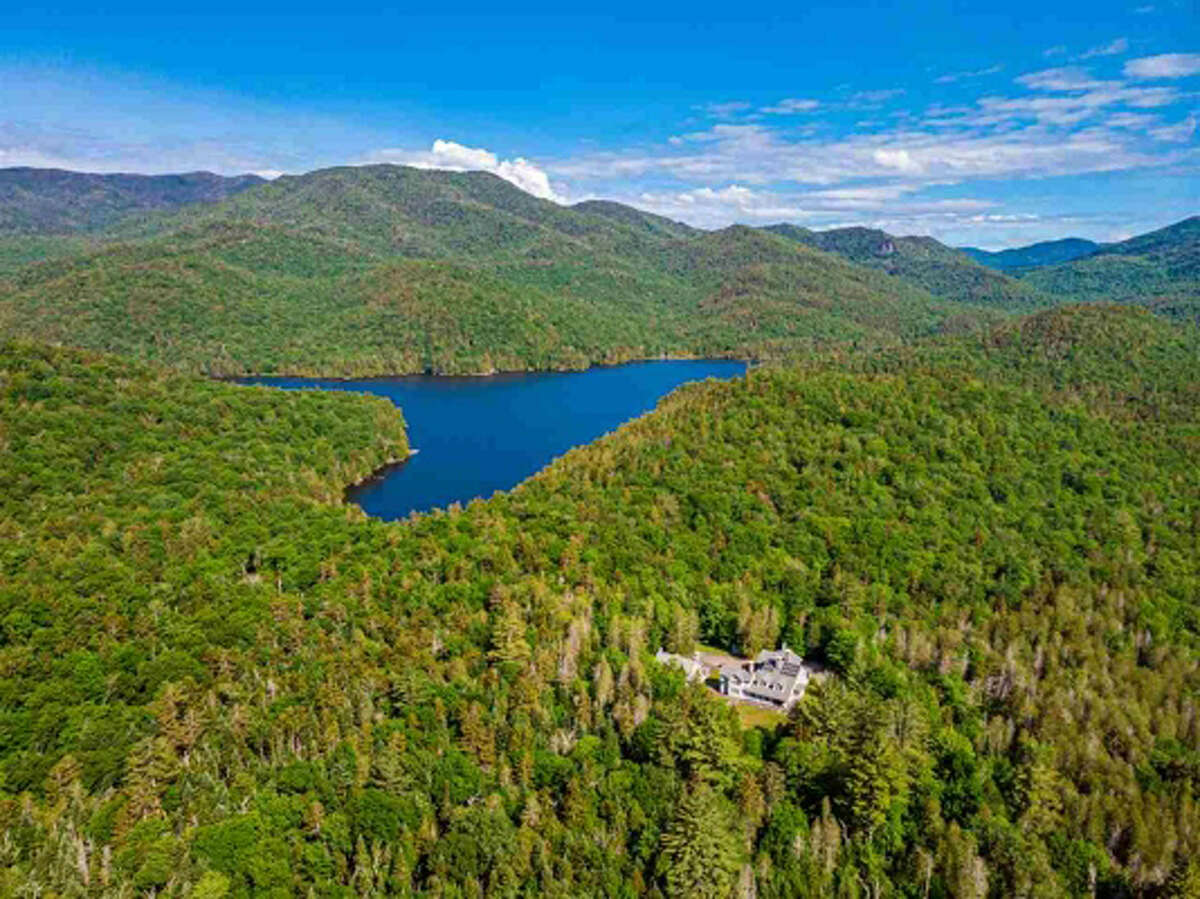 The Masten House, built in 1927, is a historic, very private retreat property nestled in the Adirondack wilderness on the edge of the High Peaks, undeveloped Henderson Lake and headwaters of the Hudson River. The grand mansion features a large modern kitchen, 8 bedrooms, 10 fireplaces and a guest house. View listing.