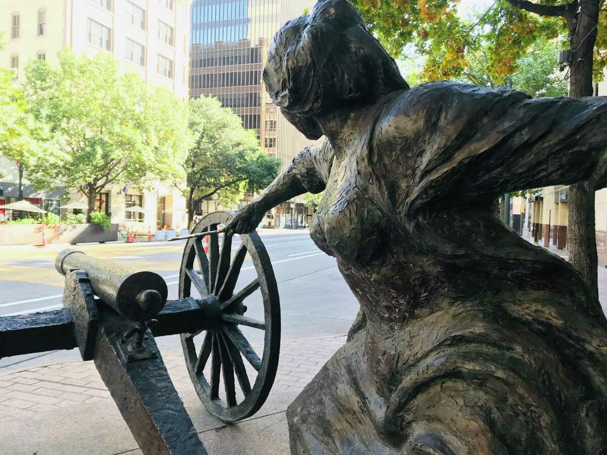 A bronze statue depicts innkeeper Angelina Belle Peyton Eberly across Congress Avenue in Austin.