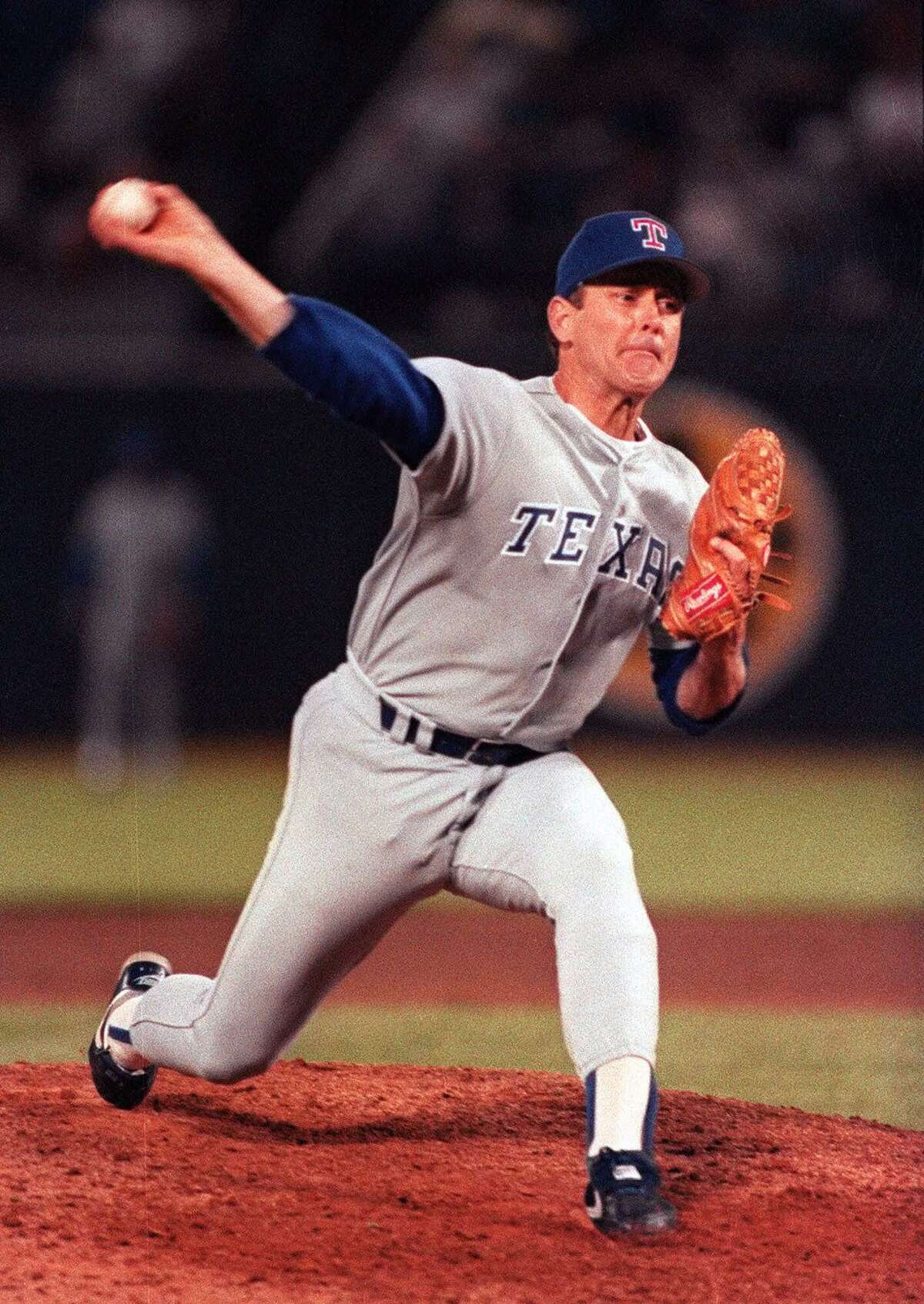 Texas Ranger's pitcher Nolan Ryan pitches during his sixth career no-hitter at the Oakland Coliseum in Oakland, Calif, in this June 11, 1990 file photo. Ryan became the oldest man to pitch a no-hitter, the only person to pitch a no-hitter for three teams, and the only one to pitch a no-hitter in three different decades. Ryan will be inducted into the Baseball Hall of Fame in Cooperstown, N.Y., July 25. (AP Photo/File)