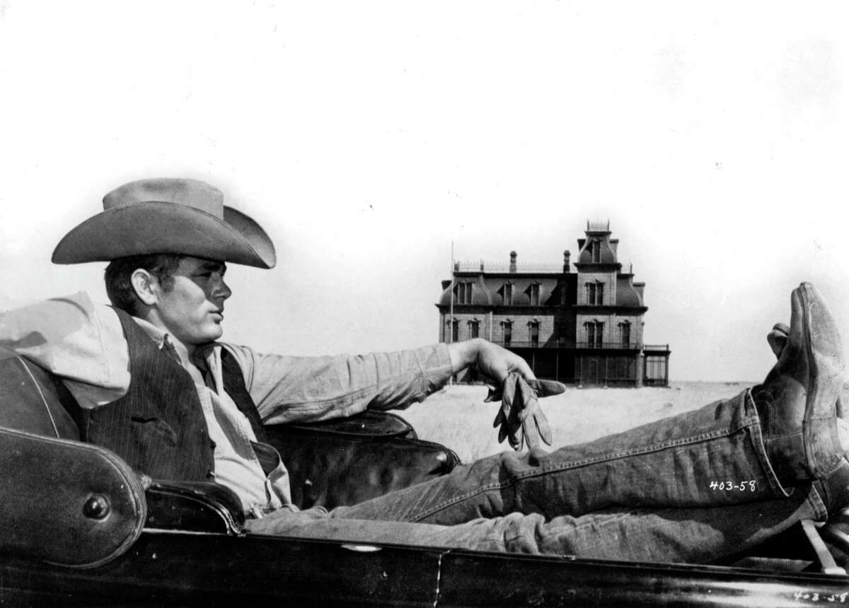 James Dean as Jett Rink in ”GIANT" (1956) with Marfa Riatta Ranch House set in background.