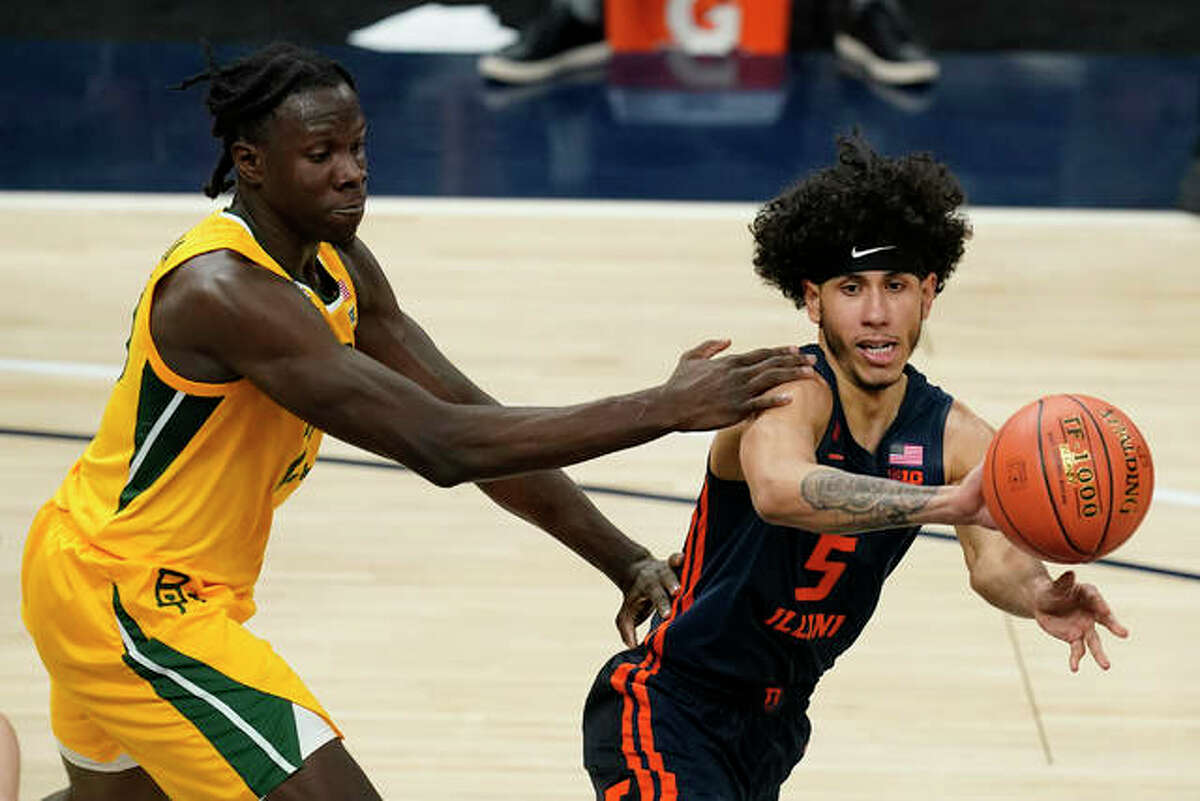 Illinois’ Andre Curbelo (5) passes the ball away from Baylor’s Jonathan Tchamwa Tchatchoua during the first half of an NCAA college basketball game Wednesday, Dec. 2, 2020, in Indianapolis.