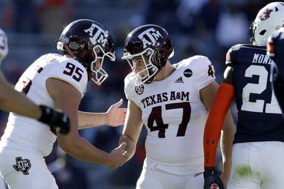 Texas A&amp;M place kicker Seth Small (47) celebrates with Texas A&amp;M holder Nik Constantinou (95) after kicking a field goal during the second half of an NCAA college football game against Auburn on Saturday, Dec. 5, 2020, in Auburn, Ala. (AP Photo/Butch Dill)