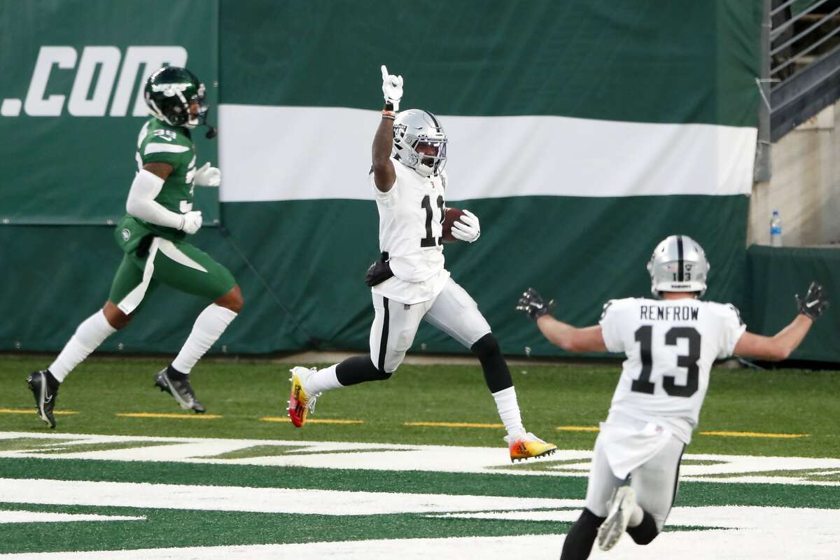 Raiders' receiver Henry Ruggs III, center, celebrates his 46-yard touchdown catch with 5 seconds play that gave Las Vegas a 31-28 win over the Jets.