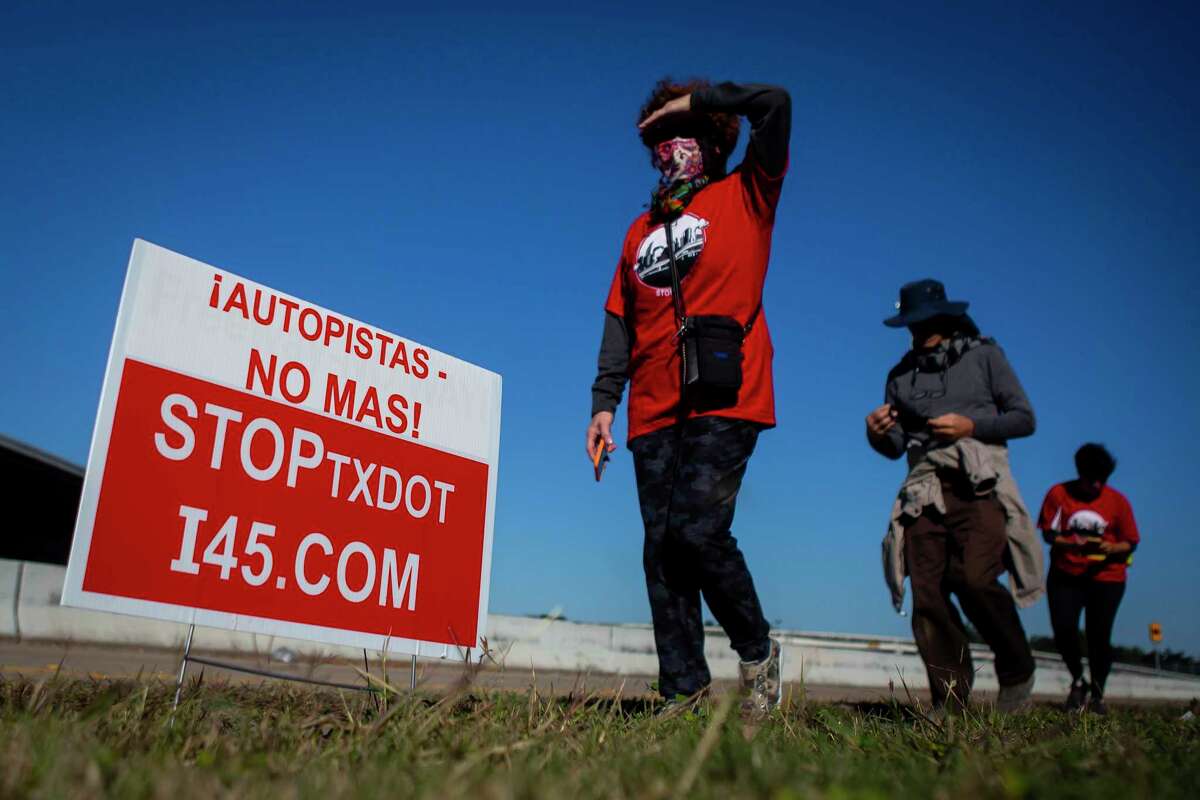 Participants walk through Fifth Ward during a protest of the I-45 expansion on Sunday, December 6, 2020.