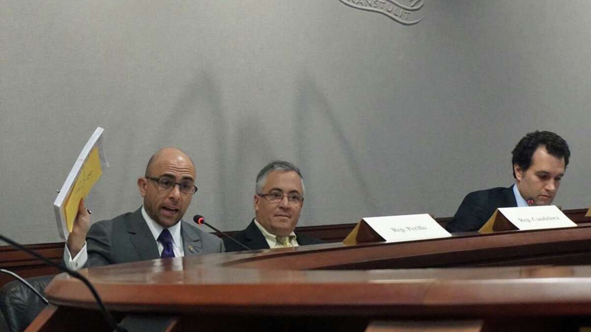 L to R: State Reps. Jason Perillo, R-Shelton, Vincent Candelora, R-North Branford, and Michael D'Agostino, D-Hamden, listen to testimony from witnesses from Stratford during a Committee on Contested Elections meeting on Thursday January 24, 2019 at the Legislative Office Building in Hartford, Conn.