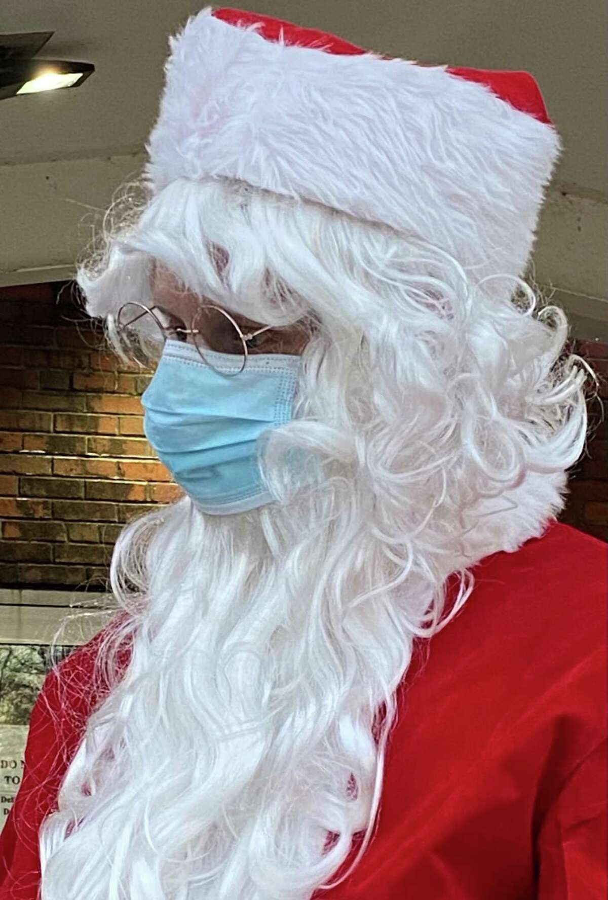Santa Claus was on hand to visit with New Milford families as gifts were handed out during the Santa Fund gift distribution on Dec. 4, 2020.