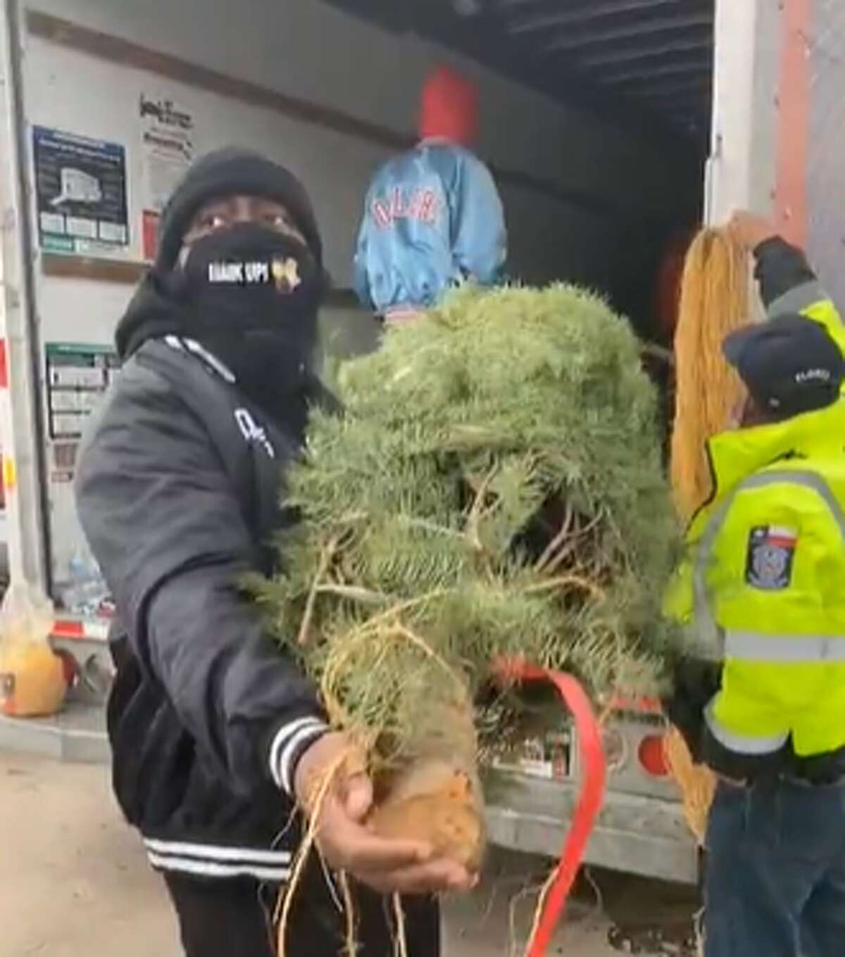 Trae tha Truth and his Relief Gang gave Christmas trees to 100 families on Saturday.