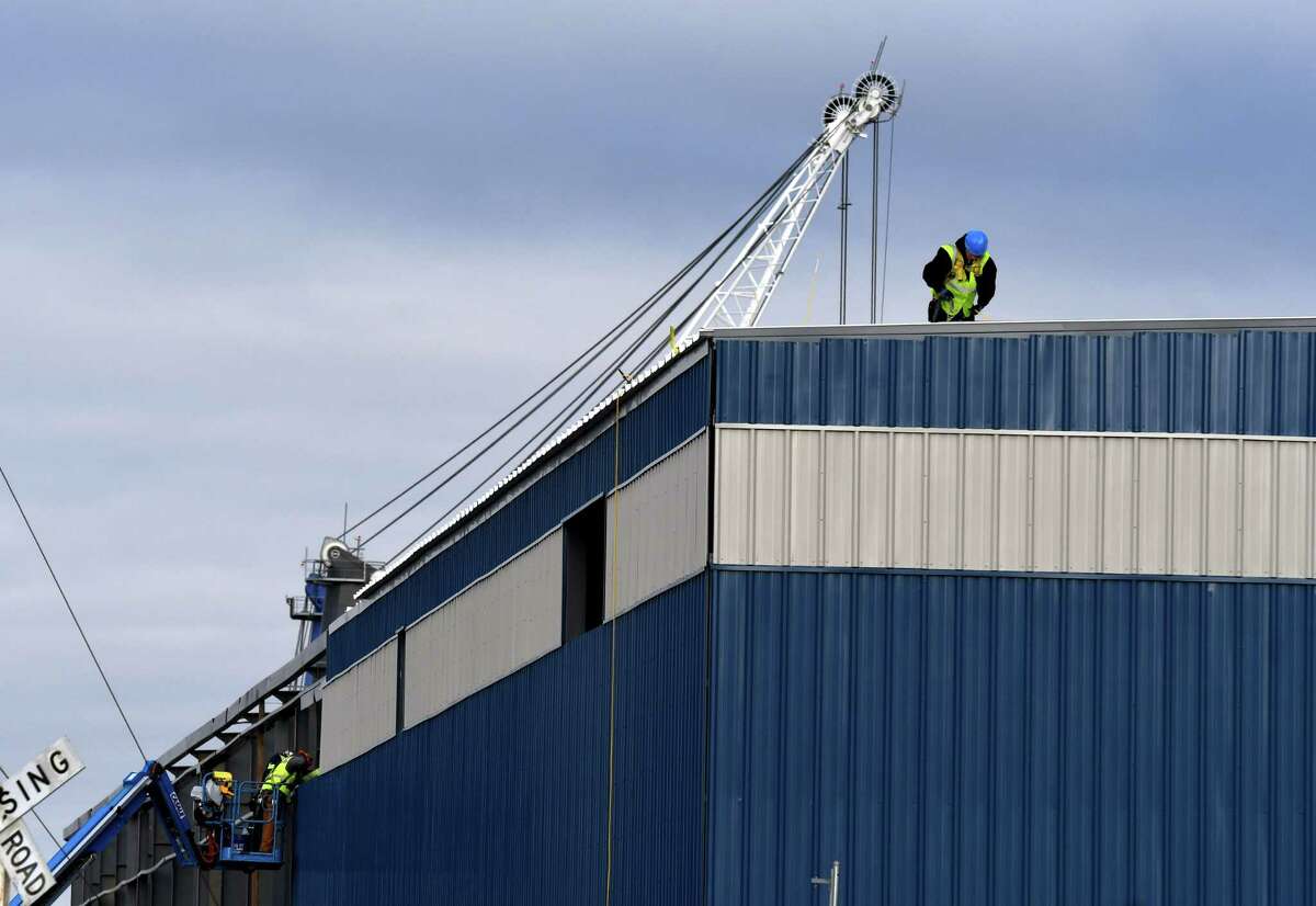 Siding is added to a new warehouse being constructed at the Port of Albany on Monday, Dec. 7, 2020, on Smith Boulevard in Albany, N.Y. (Will Waldron/Times Union)