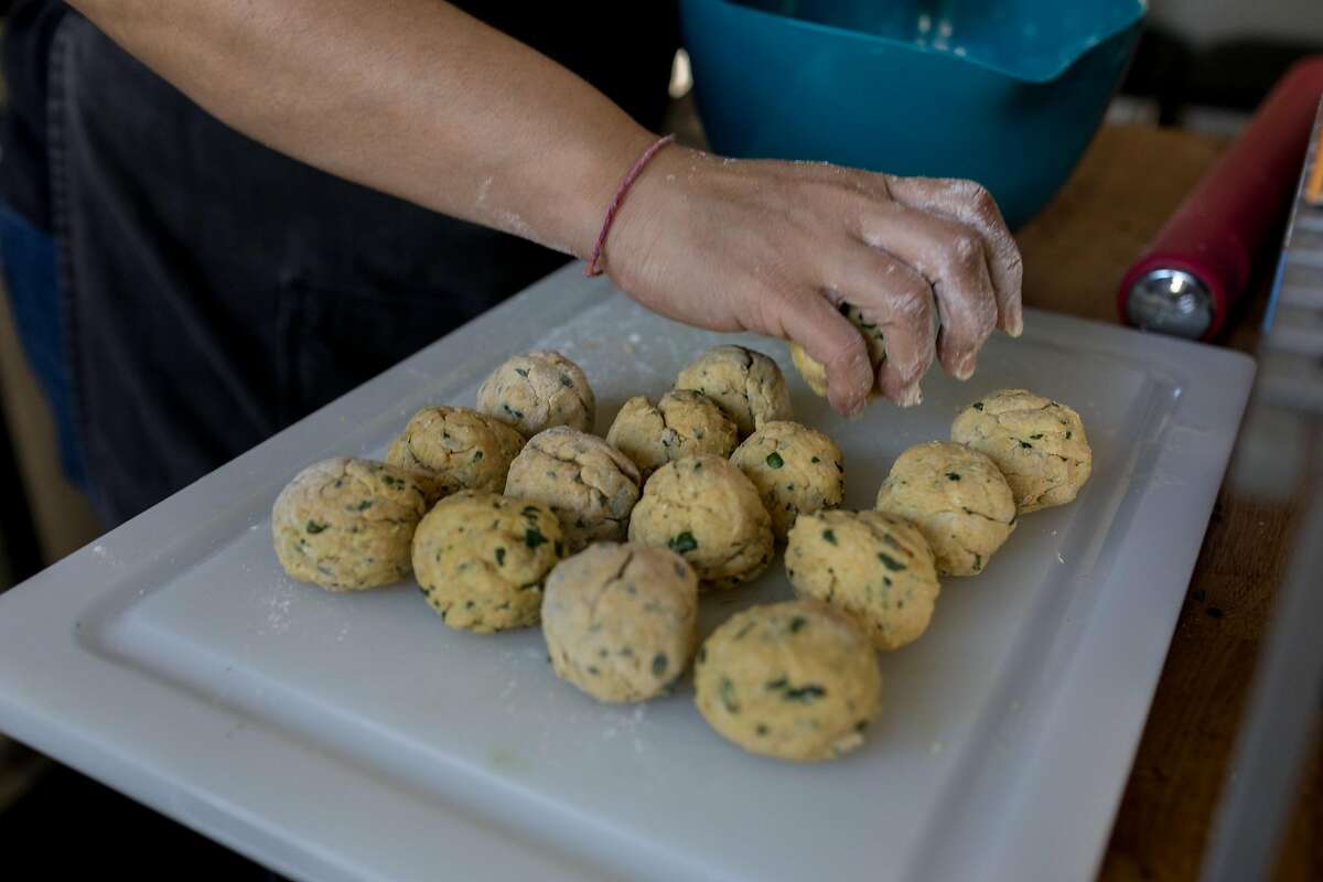 Annelies Zijderveld begins to shape. dough while learning how to make methi thepla via Zoom call with Leena Trevedi-Grenier at her home in Oakland, California on Friday, Decemberr 4, 2020.