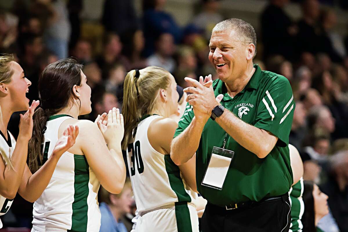 Freeland coach Tom Zolinski cheers following his Falcons' comeback victory over Hamilton in a March 22, 2020 Division 2 state semifinal.