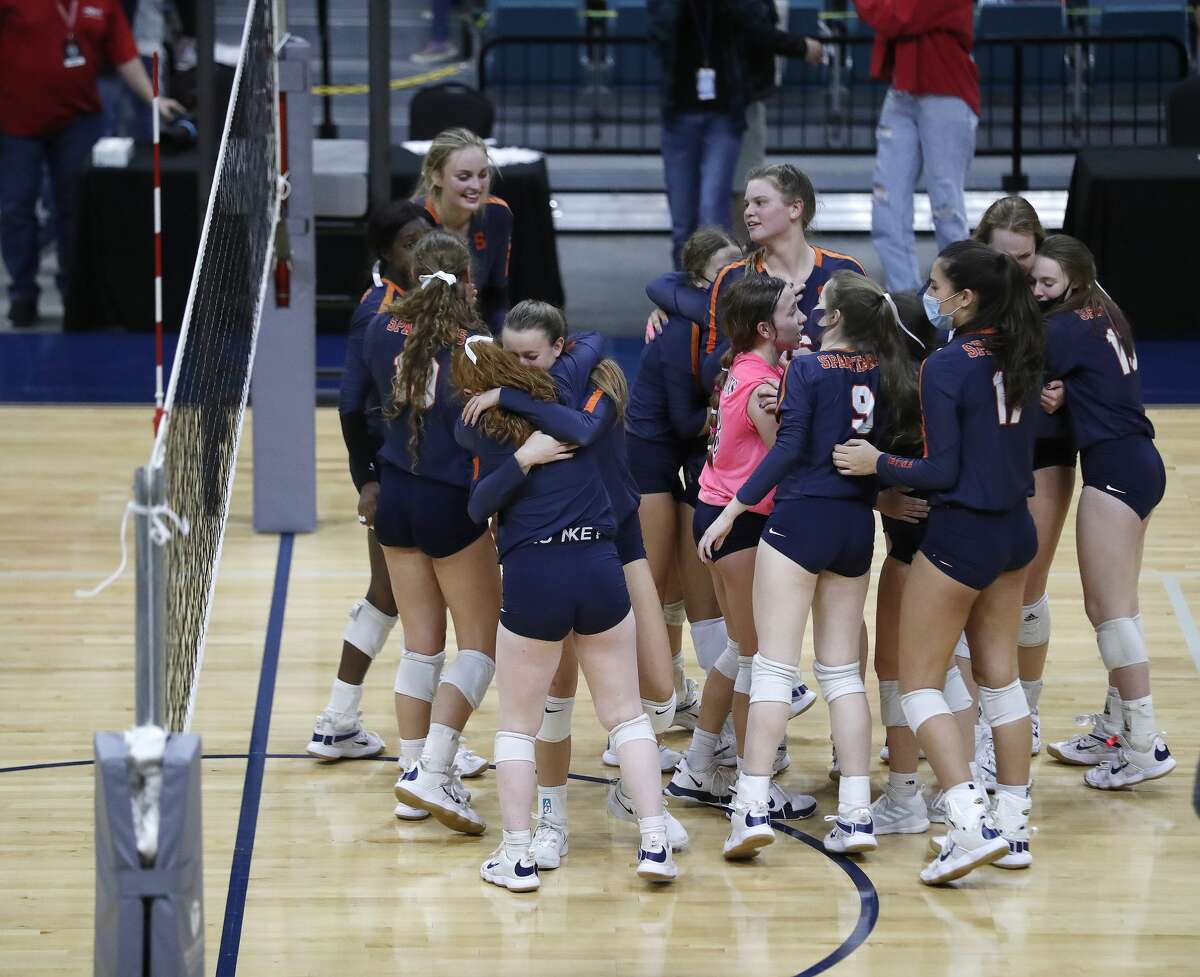 Seven Lakes team members celebrate after winning the final match against Reagan High School during a state semifinal volleyball game at The Merrell Center, Monday, December 7, 2020, in Katy. Seven Lakes advances.