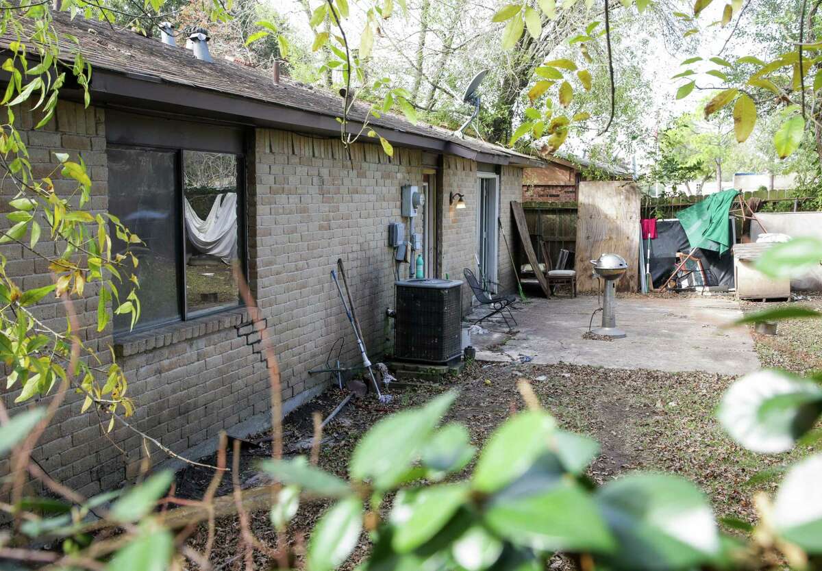 A view of the back door at 4846 Raven Ridge Drive, where Houston Police discovered more than two dozen people who were victims of an apparent human smuggling operation, on Friday, Dec. 4, 2020, in Houston.