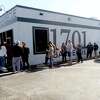 A line wraps around the building at the Friday opening of 1701 Barbecue in Beaumont, which had its grand opening Tuesday. Photo taken Friday, December 4, 2020 Kim Brent/The Enterprise