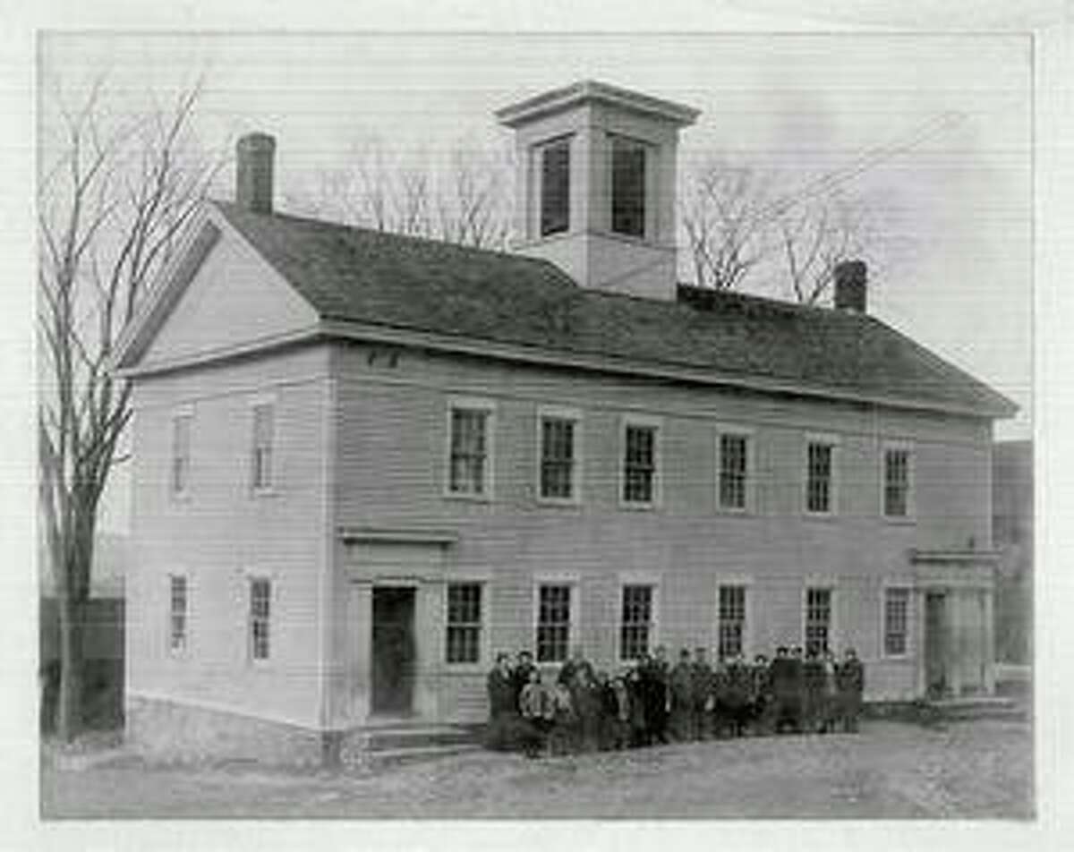The Grange Hall, located between Main and Center streets in Bridgewater, was built in 1854 as a meetinghouse before the town was incorporated. Over the years, it was re-purposed into a meeting place, town hall, school and, eventually, grange hall. In 1901, the local grange purchased the building and established the home of Bridgewater Grange #153, which is gearing up for its 120th anniversary. Ninety-eight years later, the hall was sold to the town for $1 with the understanding that the town would maintain the building and the grange organization would always be able to call it home. In more recent years, the building has been condemned, but now a group of local residents is forming a non-profit organization in hopes of preserving and restoring the structure. Numerous grange members are shown above in this undated, black and white photo. For more information about the grange hall, see story Page S1.