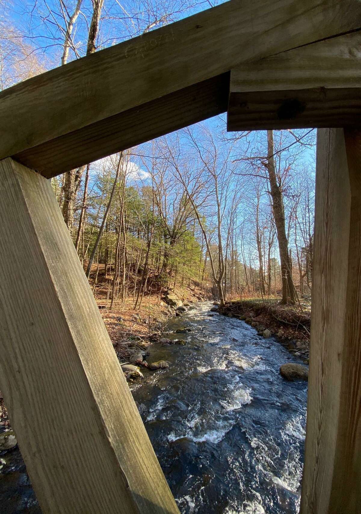 Steep Rock Association's Hidden Valley Preserve is one of the scenic locations for hikers in town. Hikers must cross this wooden bridge, with views of rushing waters, before entering the preserve along Bee Brook Road.