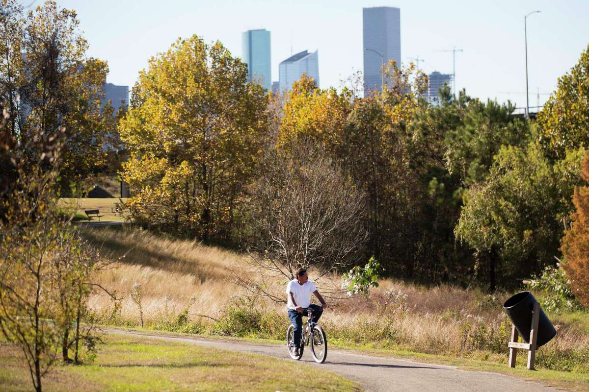 Emilio Rodriguez rides his bike along a trail at Tony Marron Park Tuesday, Dec. 8, 2020 in Houston. The park currently consists of 19 city-owned acres but will be doubled and re-imagined in collaboration with the Buffalo Bayou Partnership as a signature central green space for residents of the East End and Second Ward. A $10 million grant from the Houston Endowment is providing funds for conceptual designs by Michael Van Valkenburg Associates and Natalye Appel Architects for this project and two others along the Bayou's east sector, the first steps toward making long-discussed plans a reality.