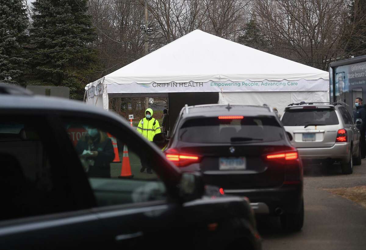 Cars line up for free Covid-19 testing at Griffin Hospital's new drive through testing site at Unity Park in Trumbull, Conn. on Tuesday, December 8, 2020. Testing will be available each Tuesday at the site from 9:30 am to 3 pm.