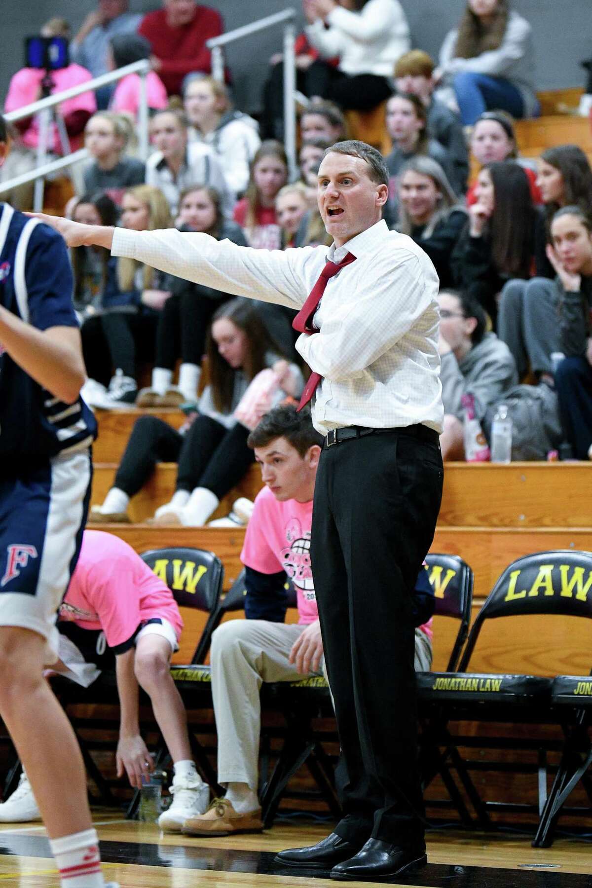 Foran boys basketball coach Ian Kirkpatrick believes letting players take breaks while wearing masks is the way to go.