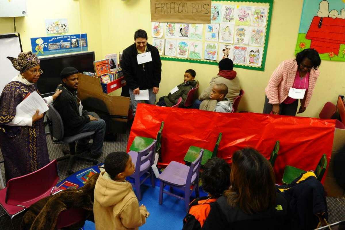 Pearl Sams Allen, left, holds an interactive program entitled “The Bus Program” held at the Old Mill Green Library in Bridgeport in February 2013. She is an African American Cultural Consultant that helped children learn stories in Black history. Connecticut has become the first state in the nation to require all high schools in the state offer courses on African American, Black, Puerto Rican, and Latino studies, Gov. Ned Lamont announced on Wednesday, Dec. 9, 2020.