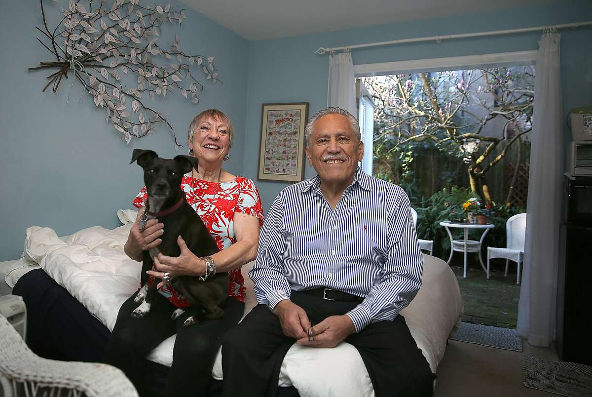 Airbnb hosts Karen Cancino with Indy (left) and her husband Rodolfo Cancino (right) show their airbnb home on Friday, February 16, 2018, in San Francisco, Calif. A $68-per-share pre-IPO price would value AirBnB over $40 billion according to analysts.