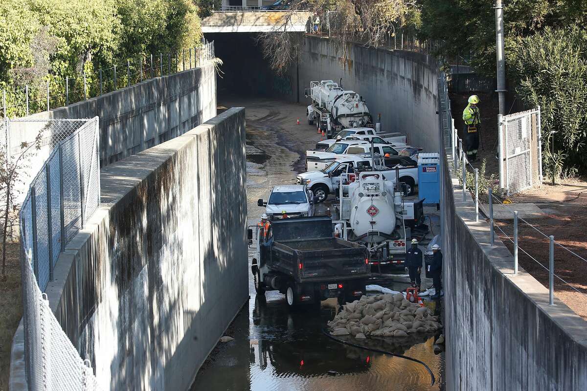 A crew works in the canal adjacent to the Iron Horse Trail on Wednesday.