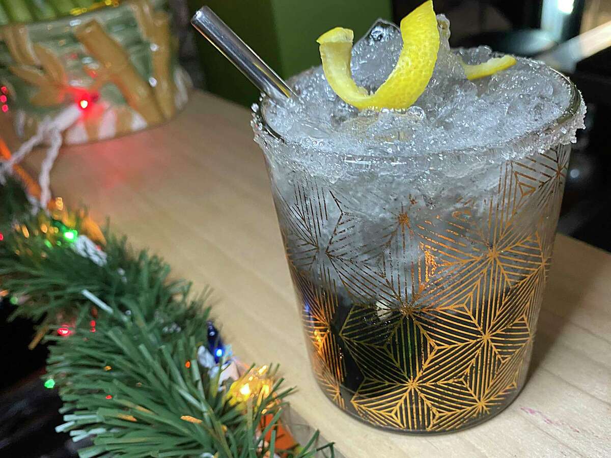 Hash Vegan Eats specializes in alcohol-free mocktails like this Charcoal Chilton with lemon, Topo Chico, agave, activated charcoal, and zero-proof Ritual Gin.