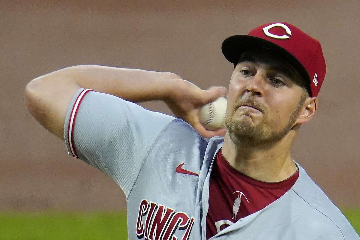 In this Sept. 4, 2020, file photo, Cincinnati Reds starting pitcher Trevor Bauer delivers during the first inning of the second baseball game of the team's doubleheader against the Pittsburgh Pirates in Pittsburgh.Bauer won the NL Cy Young Award on Wednesday night, Nov. 11, 2020. (AP Photo/Gene J. Puskar, File)
