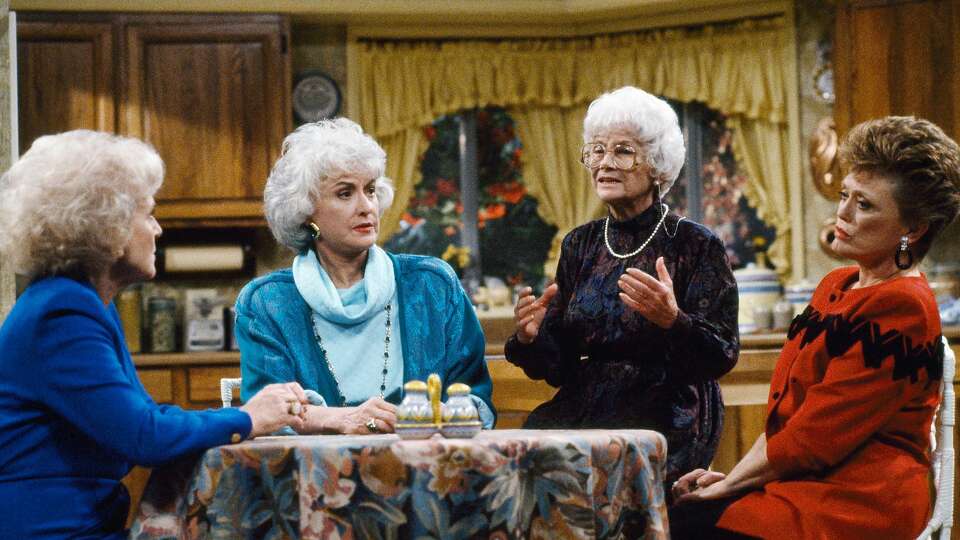 THE GOLDEN GIRLS -- 'Mrs. George Devereaux' Episode 9 -- Aired 11/17/90 -- Pictured: (l-r) Betty White as Rose Nylund, Bea Arthur as Dorothy Petrillo Zbornak, Estelle Getty as Sophia Petrillo, Rue McClanahan as Blanche Devereaux (Photo by Ron Tom/NBC/NBCU Photo Bank via Getty Images)