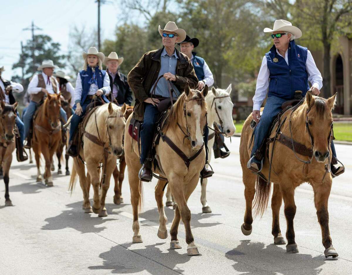 Members of the Houston Live Stock and Rodeo ride horses along the parade route at this year's Go Texan Parade in downtown Conroe, Saturday, Feb. 22, 2020. It was announced Wednesday that the Go Texan parade will not take place in 2021.