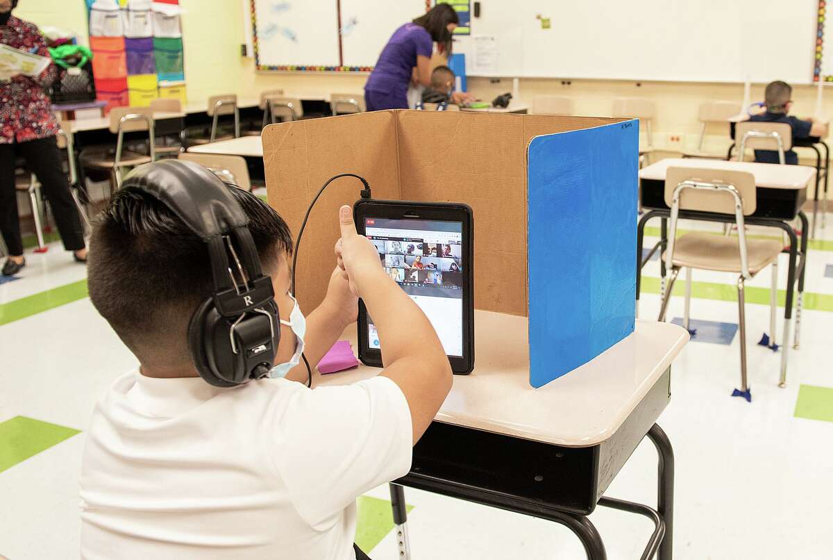 M.S. Ryan Elementary student Elias Lozano checks in with his teacher in their virtual classroom on Aug. 24, 2020 during the first day back to school for some students.