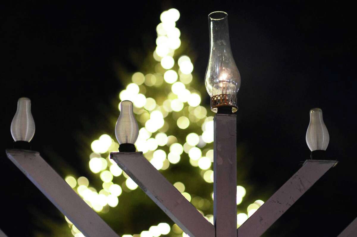 Rabbi Levi Stone of the Schneerson Center of Jewish Life lights the menorah at the Wilton town green on Dec. 22, 2019. The menorah will be lit this year at 4 p.m. on Sunday, Dec. 13.