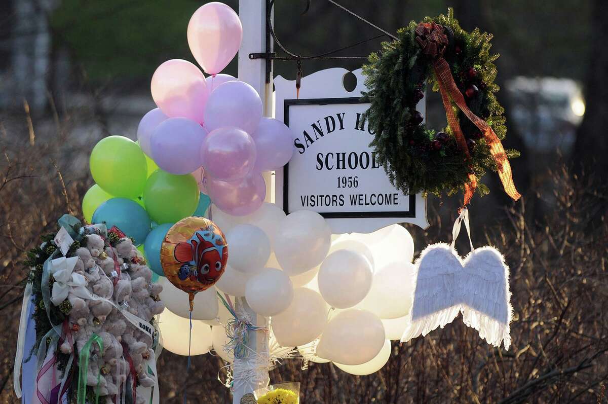 Flowers, teddy bears, candles, balloons and a pair of angel wings left by mourners are seen at the Sandy Hook Elementary School sign in Newtown in 2012. Pozner, who lost his 6-year-old son Noah in the shooting, said he has been the victim of numerous instances of online harassment. After the death of his son, conspiracy theorists attempted to disprove the tragedy and even allege that Pozner and other parents were being paid to stage their children's deaths. “He copyrighted photos of his son to control how they’re used,” Pelley said. “He published a letter to Facebook’s CEO that read, ‘You have deemed our lives are less important than providing a safe haven for hate.’” In 2016, Pozner went to the FBI for help with cyberstalking after his personal information was being doxed online. In the interview, he said he had to move his family half-a-dozen times to escape the harassment.  Lucy Richards, of Florida, was arrested and sentenced to five months in prison after police said she was among those harassing Pozner - leaving him threatening voicemails that detailed his death. "There isn't any longer a separation between the online world and the offline world," Pozner told Pelley. "What is said about you will carry over into your personal life, into your career, into your relationships, into your community. And it will impact your life." 