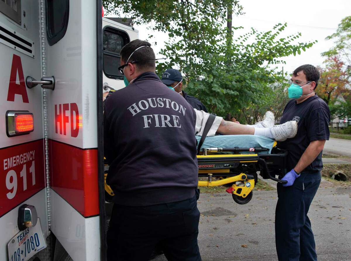 24-hour shifts and sleeping in masks. Houston firefighters are ...