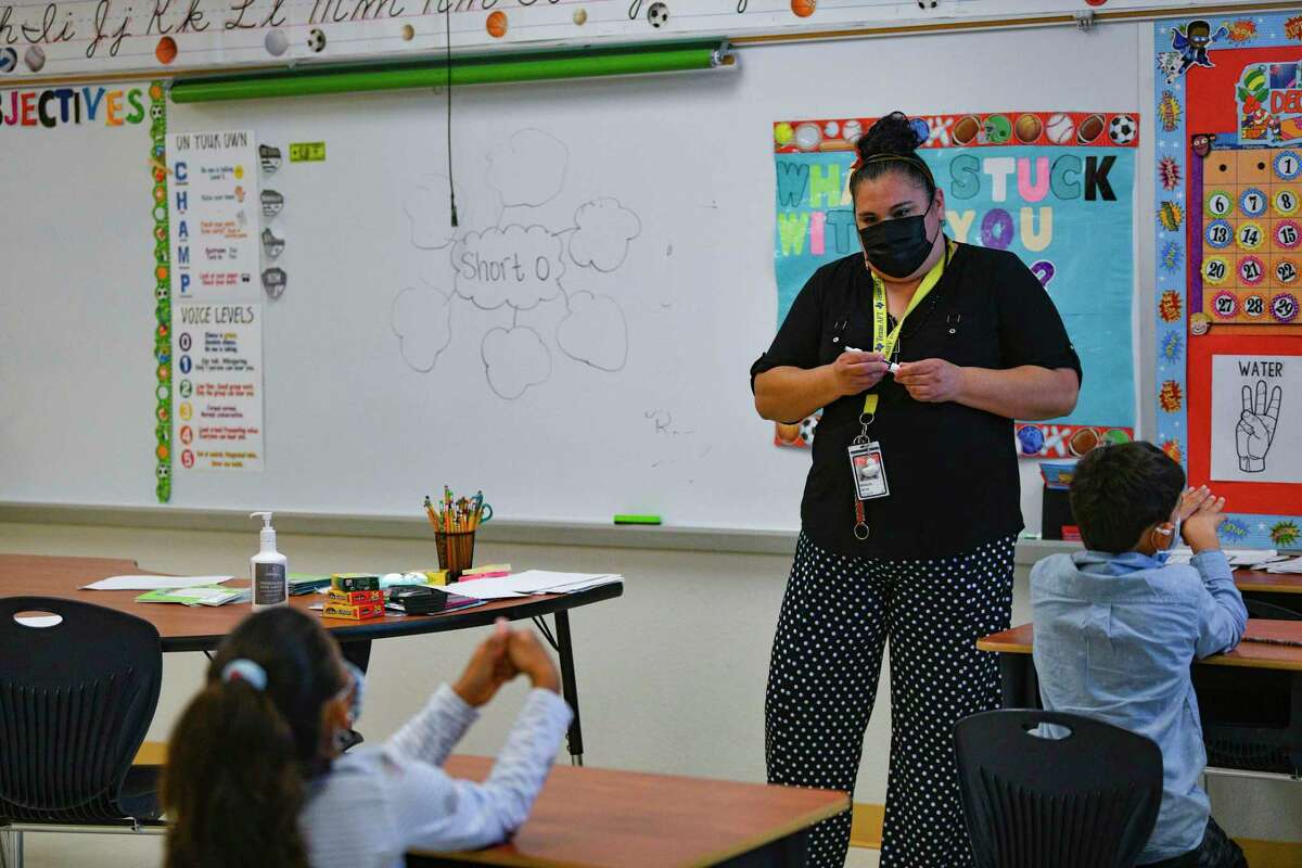 Vanessa Garza, an intervention teacher at Copperfield Elementary School in Judson ISD, works with students on Thursday.