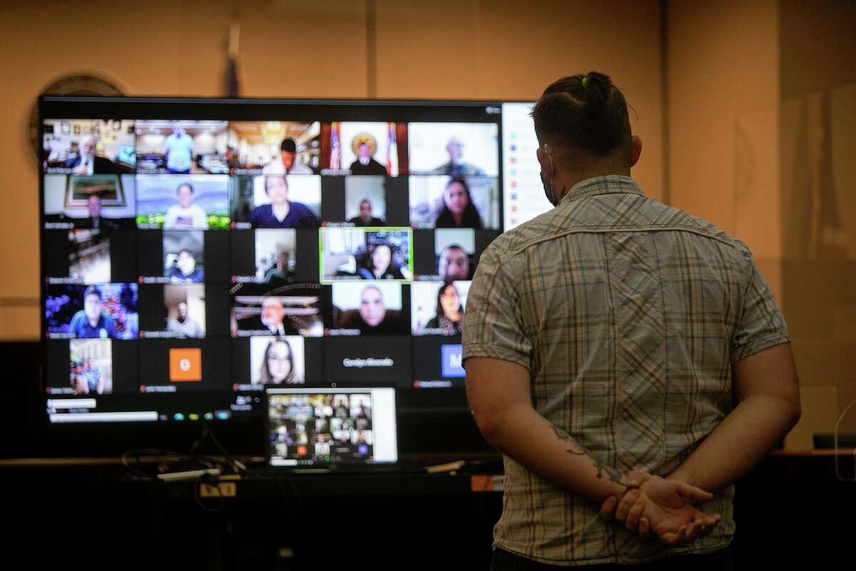 A Felony Veterans Treatment Court graduate stands before judges, mentors, fellow graduates and others involved with the program on Zoom during his graduation from the program at the Cadena Reeves Justice Center in San Antonio on Thursday.