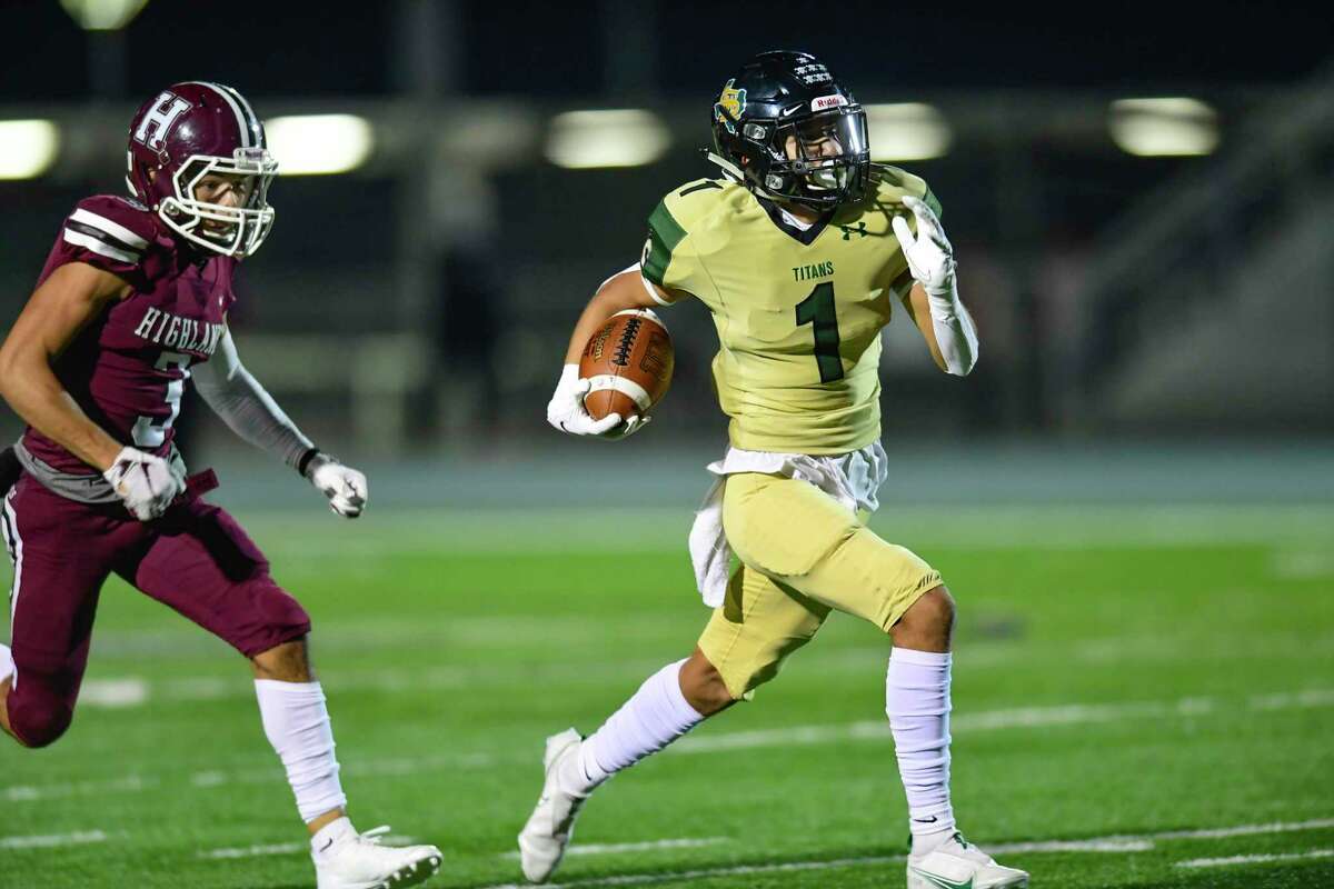 Southwest Legacy receiver Jeremiah Sifuentes runs for yardage as he is chased by Luis Ortiz of Highlands during high school football playoffs action at Titan Stadium on Friday, Dec. 11, 2020.